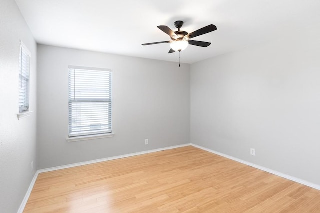 601 Abundance Ln, Kyle, TX 78640 - empty room with light wood-type flooring, healthy amount of natural light, a ceiling fan, and baseboards
