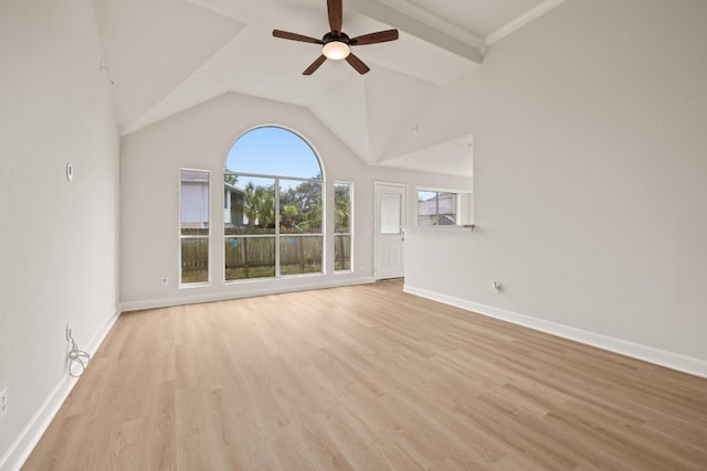 unfurnished living room with baseboards, light wood-style flooring, ceiling fan, and vaulted ceiling