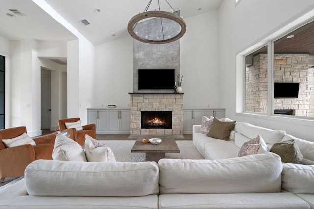 13213 Meridian Park Blvd, Austin, TX 78739 - living room with a stone fireplace, high vaulted ceiling, and wood finished floors