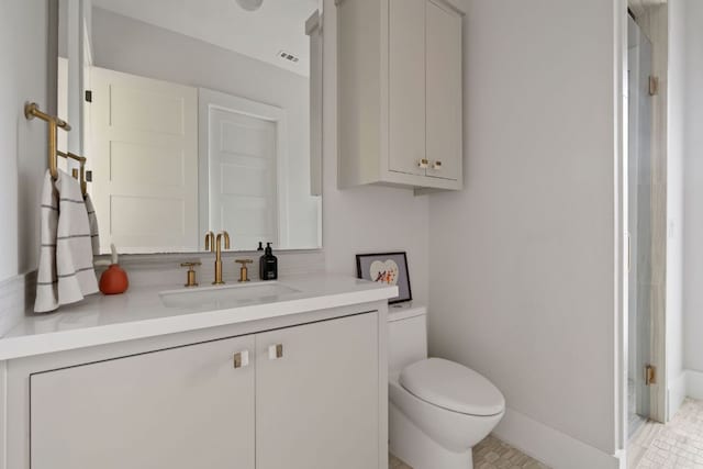 13213 Meridian Park Blvd, Austin, TX 78739 - bathroom with toilet, vanity, and baseboards