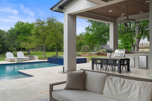 13213 Meridian Park Blvd, Austin, TX 78739 - swimming pool with an outdoor kitchen, grilling area, outdoor dining space, a patio, and a lawn