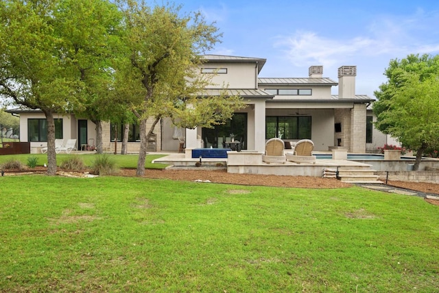 13213 Meridian Park Blvd, Austin, TX 78739 - rear view of property with a standing seam roof, a chimney, a yard, and metal roof