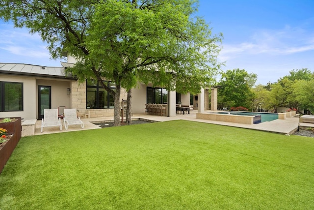 13213 Meridian Park Blvd, Austin, TX 78739 - rear view of property with a standing seam roof, a patio area, an outdoor pool, stucco siding, and a yard