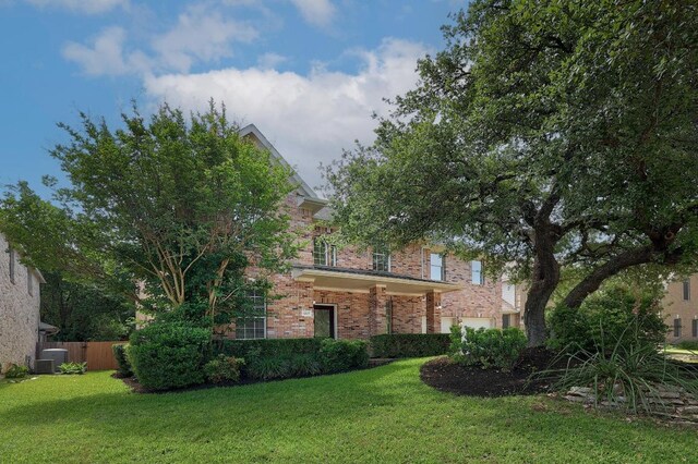 12207 Carlsbad Dr, Austin, TX 78738 - view of property hidden behind natural elements with brick siding