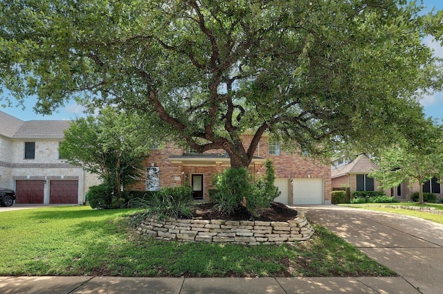 12207 Carlsbad Dr, Austin, TX 78738 - view of property hidden behind natural elements with driveway, a front yard, and brick siding