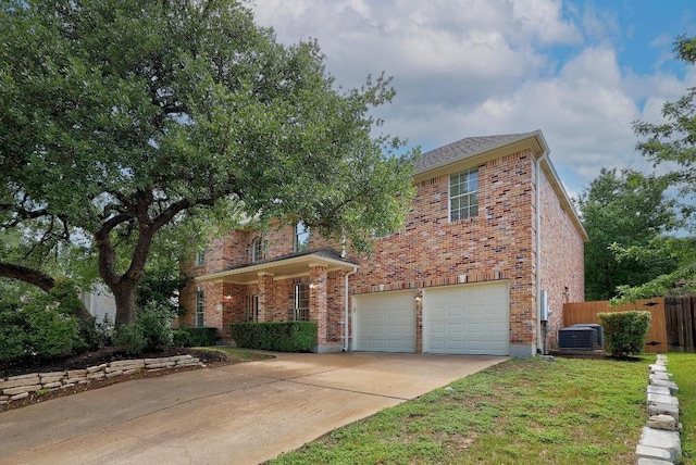 12207 Carlsbad Dr, Austin, TX 78738 - view of front facade with an attached garage, driveway, and brick siding