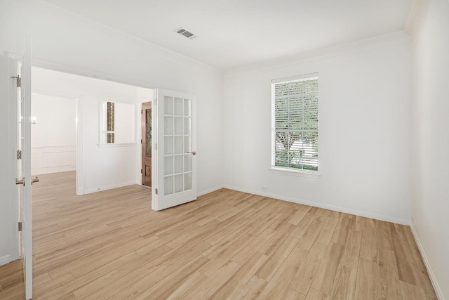 12207 Carlsbad Dr, Austin, TX 78738 - unfurnished room featuring light wood-type flooring, ornamental molding, and french doors