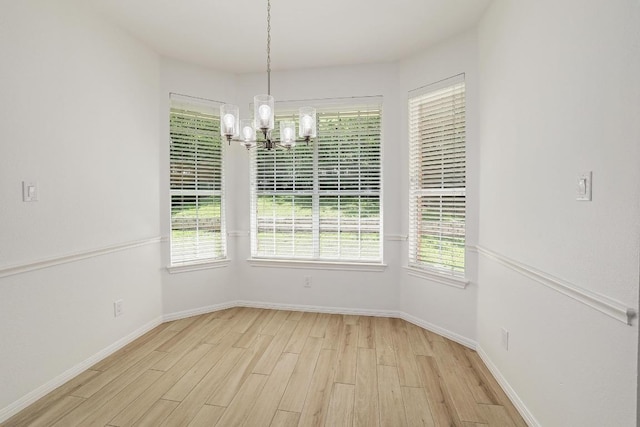 12207 Carlsbad Dr, Austin, TX 78738 - unfurnished dining area with a chandelier and light wood-style floors