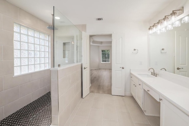 12207 Carlsbad Dr, Austin, TX 78738 - full bath featuring tile patterned flooring, walk in shower, vanity, and recessed lighting
