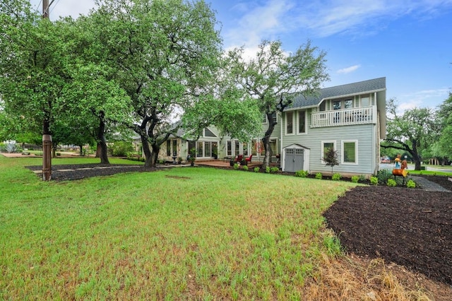 10305 Pickfair Dr, Austin, TX 78750 - view of green lawn featuring a balcony and a shed