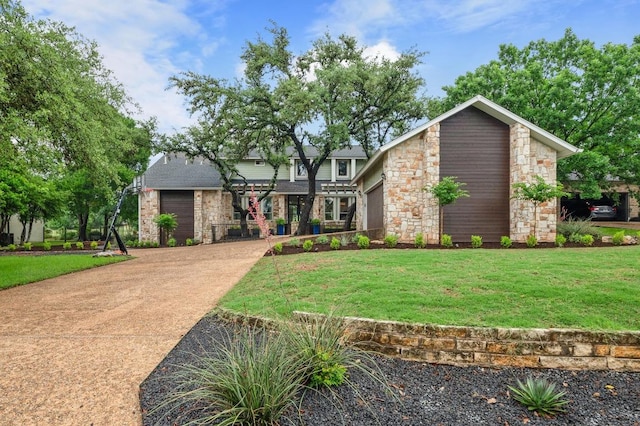 10305 Pickfair Dr, Austin, TX 78750 - view of front of property featuring stone siding and a front yard