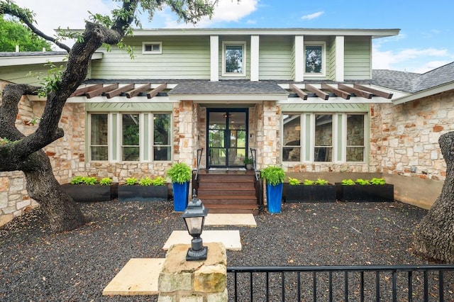 10305 Pickfair Dr, Austin, TX 78750 - view of front of property with stone siding and roof with shingles