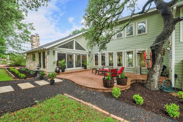 10305 Pickfair Dr, Austin, TX 78750 - back of house featuring a chimney and a patio