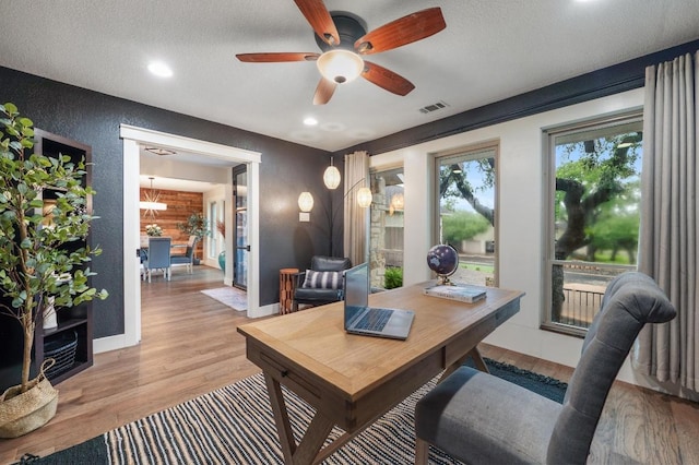 10305 Pickfair Dr, Austin, TX 78750 - office with light wood-type flooring, ceiling fan, a textured wall, recessed lighting, and a textured ceiling