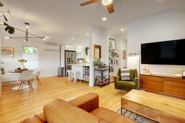 2000 E 8th St, Austin, TX 78702 - living area with a wall mounted AC, light wood-type flooring, a ceiling fan, recessed lighting, and baseboards