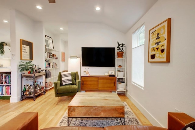 2000 E 8th St, Austin, TX 78702 - living room featuring light wood-style floors, healthy amount of natural light, lofted ceiling, recessed lighting, and baseboards