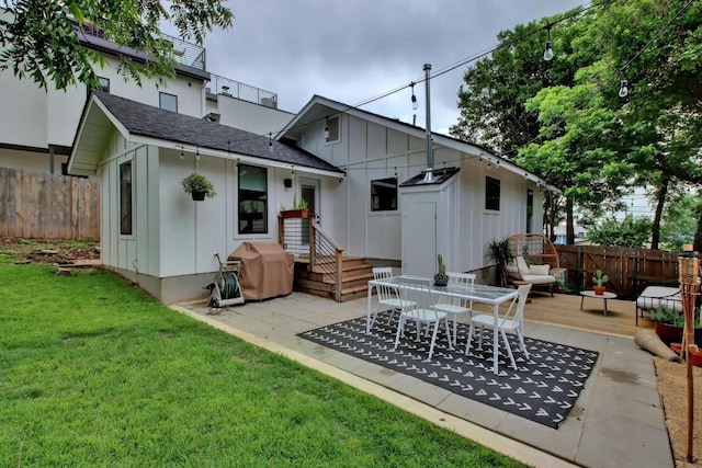 2000 E 8th St, Austin, TX 78702 - back of house with board and batten siding, a deck, a patio, and a shingled roof