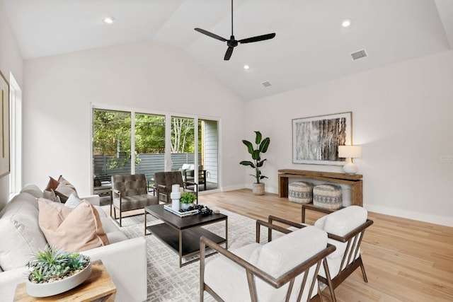 living room featuring ceiling fan, high vaulted ceiling, wood finished floors, and recessed lighting