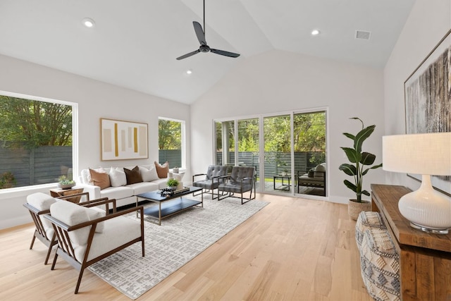living area featuring high vaulted ceiling, a ceiling fan, light wood-style floors, and recessed lighting