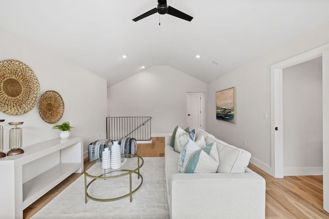 living area featuring a ceiling fan, wood finished floors, vaulted ceiling, recessed lighting, and baseboards