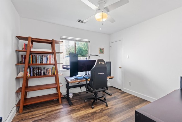 office space with wood finished floors, a ceiling fan, and baseboards