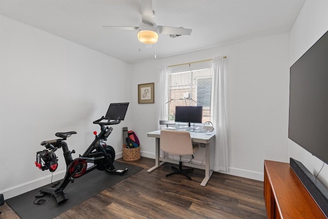 office space featuring dark wood-style flooring, baseboards, and ceiling fan