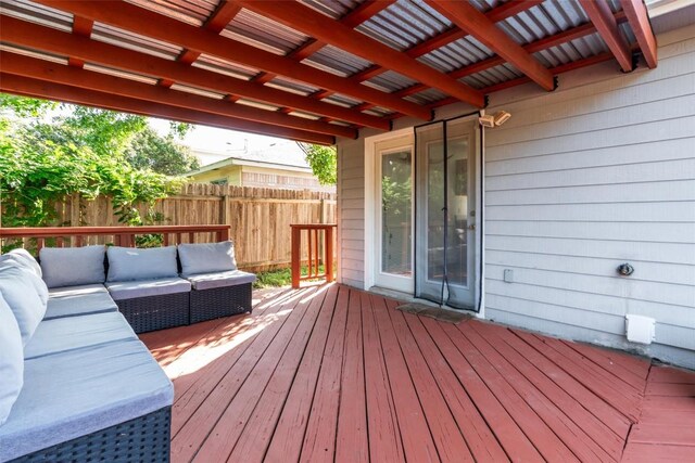 deck with outdoor lounge area and fence