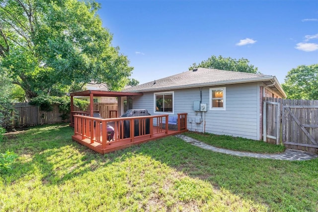 back of house featuring a wooden deck