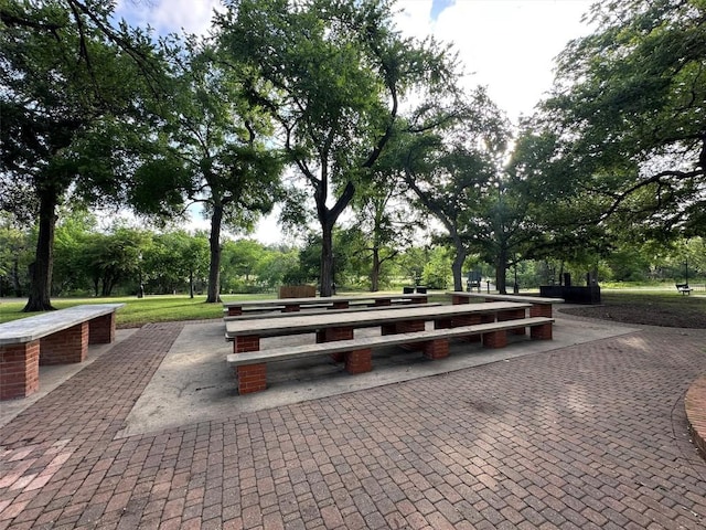 surrounding community featuring view of wooded area