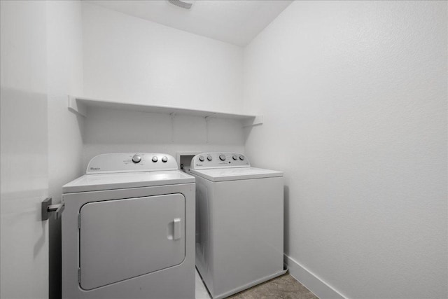 89 Jan Ln, Georgetown, TX 78626 - laundry area featuring washer and clothes dryer and baseboards