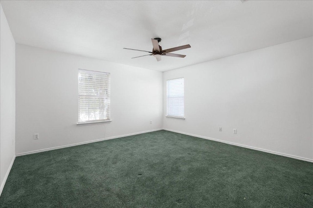 89 Jan Ln, Georgetown, TX 78626 - empty room with a ceiling fan, dark colored carpet, and baseboards