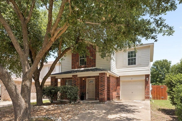 89 Jan Ln, Georgetown, TX 78626 - view of front of house featuring brick siding, concrete driveway, and a garage