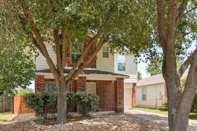 89 Jan Ln, Georgetown, TX 78626 - view of front of property with brick siding, concrete driveway, and an attached garage