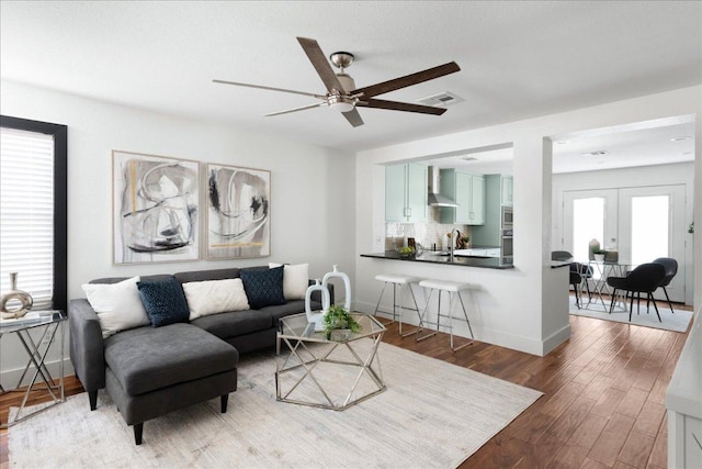 89 Jan Ln, Georgetown, TX 78626 - living area with a ceiling fan, wood finished floors, french doors, and baseboards