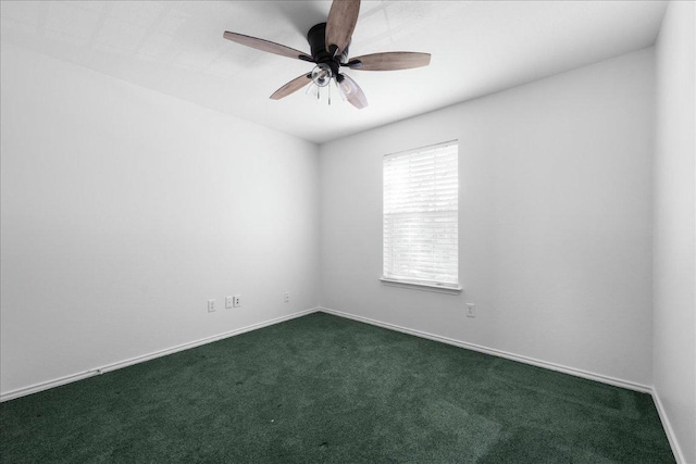 89 Jan Ln, Georgetown, TX 78626 - empty room with dark carpet, a ceiling fan, and baseboards