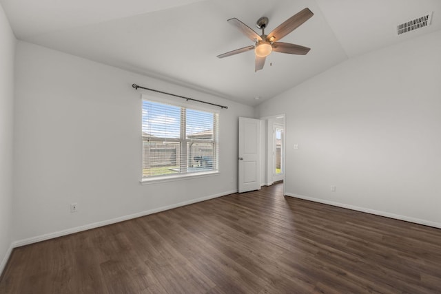 113 Evening Dusk Dr, Kyle, TX 78640 - empty room with dark wood-type flooring, a ceiling fan, lofted ceiling, and baseboards
