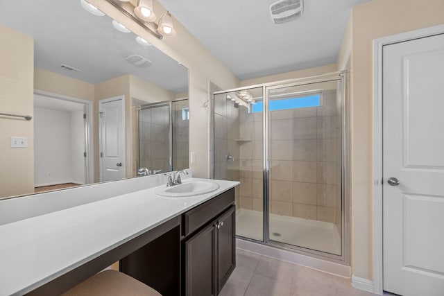 113 Evening Dusk Dr, Kyle, TX 78640 - bathroom featuring a stall shower, vanity, and tile patterned floors
