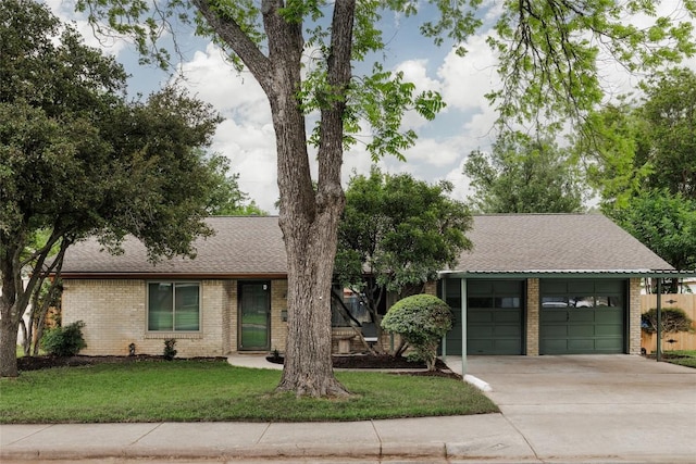 1805 Northridge Dr, Austin, TX 78723 - ranch-style home featuring brick siding, driveway, a garage, roof with shingles, and a front yard