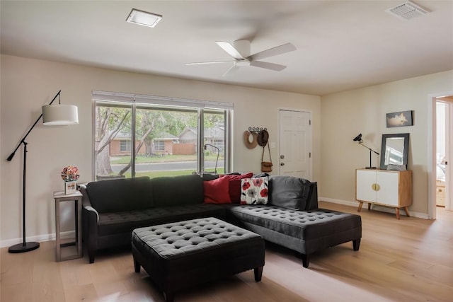 1805 Northridge Dr, Austin, TX 78723 - living room featuring light wood-style flooring, a ceiling fan, and baseboards