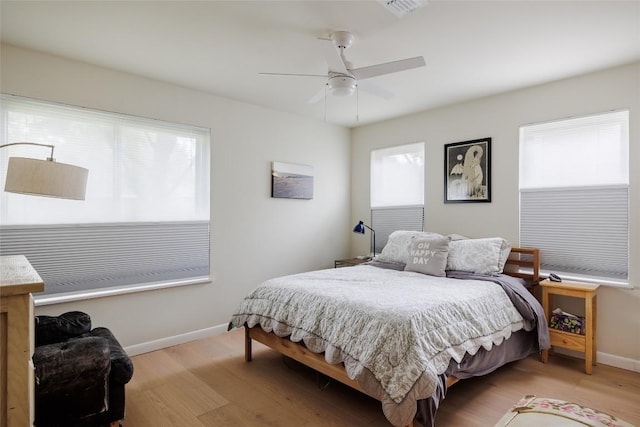 1805 Northridge Dr, Austin, TX 78723 - bedroom with light wood-style floors, baseboards, and ceiling fan