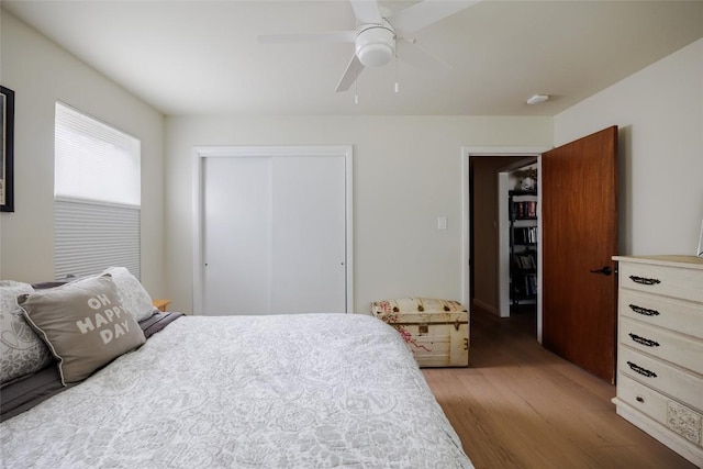1805 Northridge Dr, Austin, TX 78723 - bedroom with light wood-style floors, a closet, and a ceiling fan