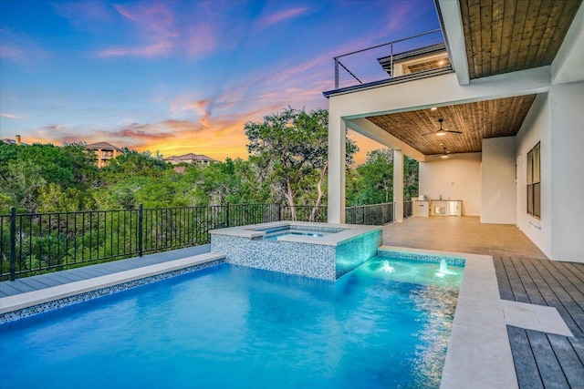 235 Canyon Turn Trl, Austin, TX 78734 - pool at dusk with a pool with connected hot tub and a ceiling fan