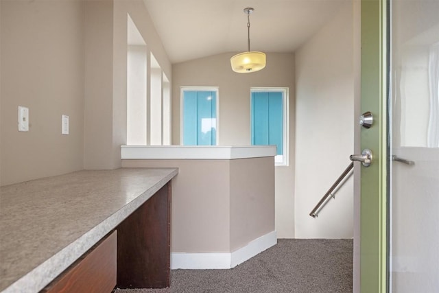 2621 Witsome Loop, Austin, TX 78741 - unfurnished dining area with carpet and lofted ceiling
