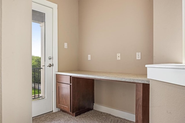 2621 Witsome Loop, Austin, TX 78741 - unfurnished office featuring light carpet and built in study area