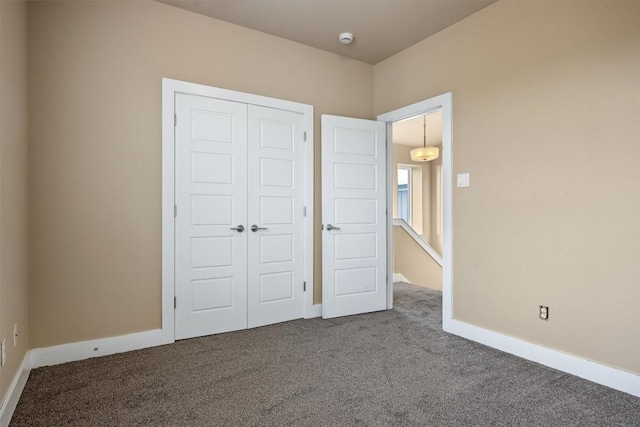 2621 Witsome Loop, Austin, TX 78741 - unfurnished bedroom featuring carpet flooring, a closet, and baseboards