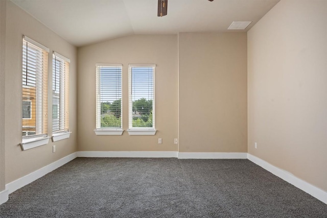 2621 Witsome Loop, Austin, TX 78741 - unfurnished room with a ceiling fan, vaulted ceiling, and dark colored carpet