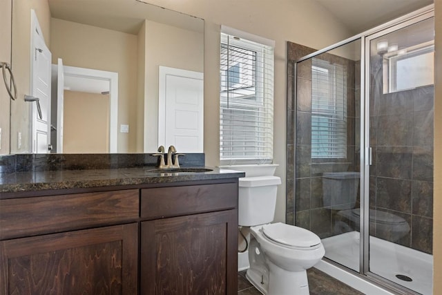 2621 Witsome Loop, Austin, TX 78741 - full bath with toilet, a shower stall, and vanity