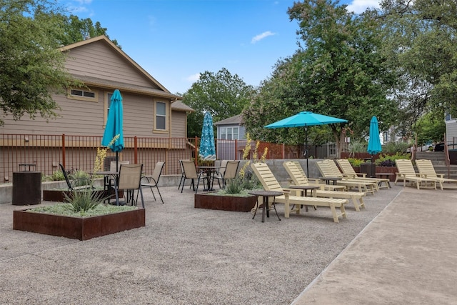 2621 Witsome Loop, Austin, TX 78741 - view of patio featuring fence, central AC, and outdoor dining space