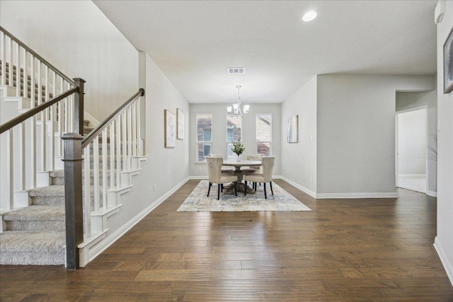 dining space featuring stairway, hardwood / wood-style floors, a chandelier, baseboards, and recessed lighting