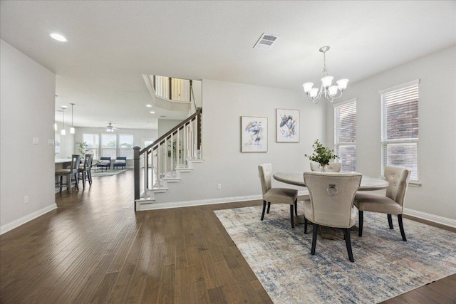 1716 Elaina Loop, Leander, TX 78641 - dining space with a chandelier, stairs, baseboards, and dark wood-style floors